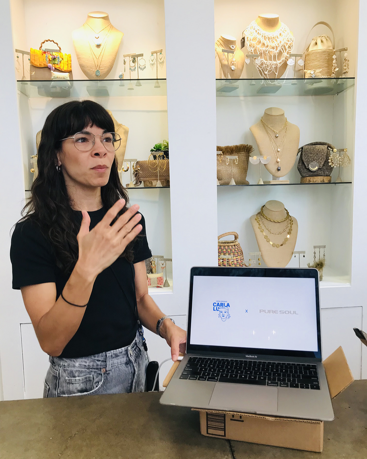 Carla presenting a Shopify project in a jewelry boutique